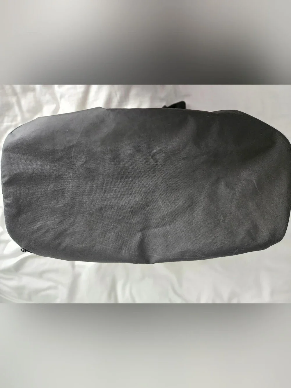 Nike Black Duffel Bag with White Swoosh and Bottom Zipper Pocket.
